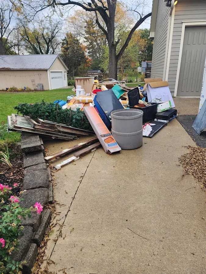 Dumpster being loaded with debris for 3 Yard Dumpster Rental in Falcon Heights